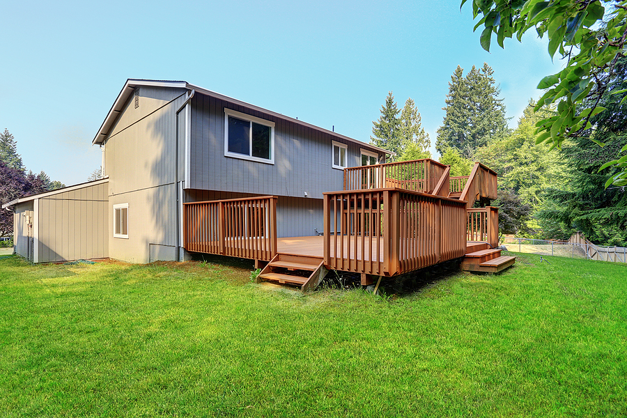 two floor wood decks with pine trees views